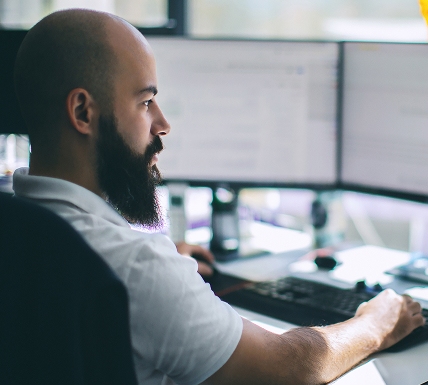 Outsourced IT Support Tech working on IT solutions